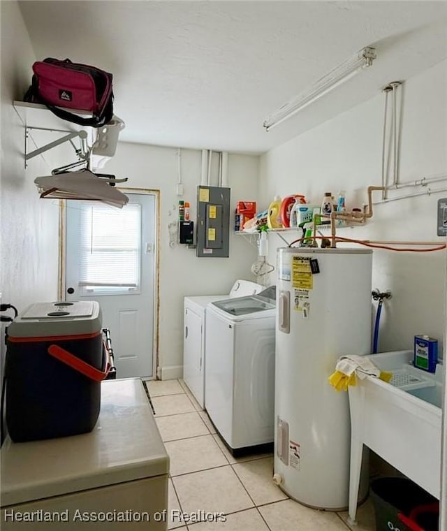315 Sirena Dr, Lake Placid, FL 33852 - clothes washing area featuring washing machine and dryer, water heater, laundry area, electric panel, and light tile patterned flooring