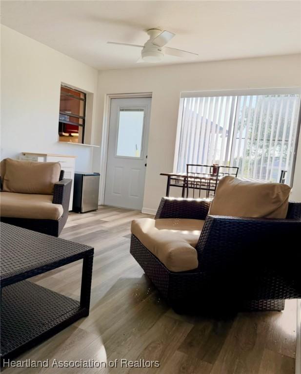 315 Sirena Dr, Lake Placid, FL 33852 - living room featuring plenty of natural light, wood finished floors, and a ceiling fan
