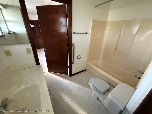 bathroom with bathtub / shower combination, toilet, and baseboards