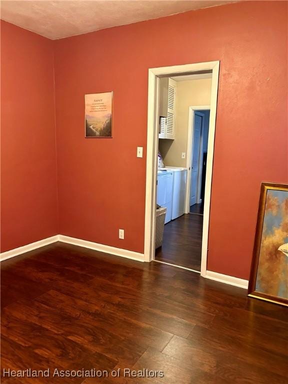 empty room with dark wood-type flooring