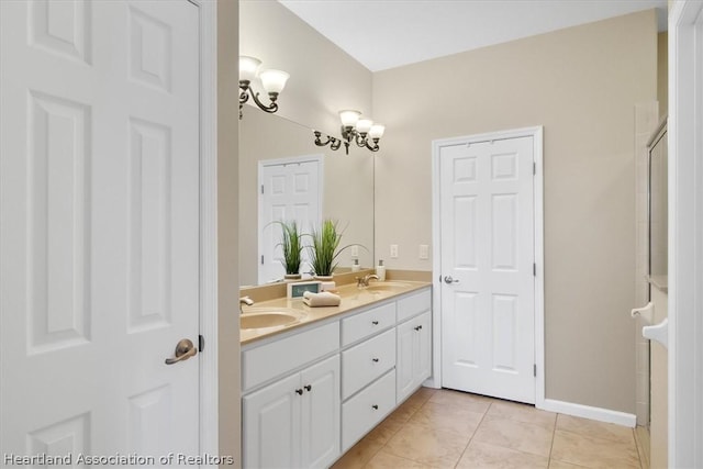 bathroom featuring tile patterned flooring and vanity