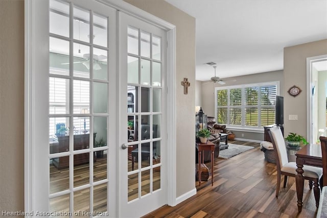 doorway to outside featuring ceiling fan, dark hardwood / wood-style floors, and french doors