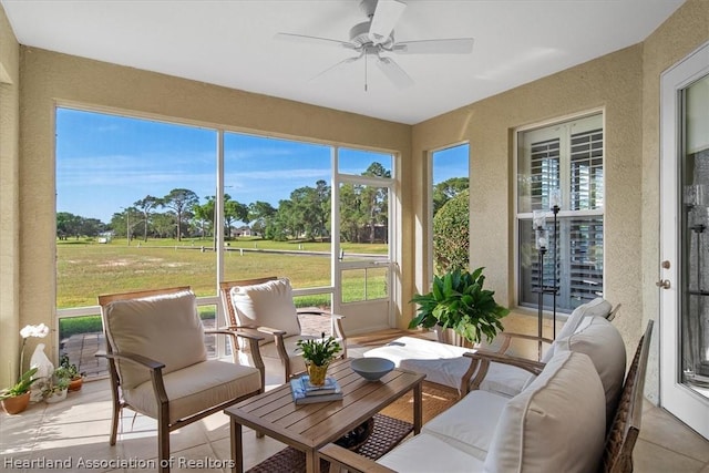 sunroom / solarium with ceiling fan