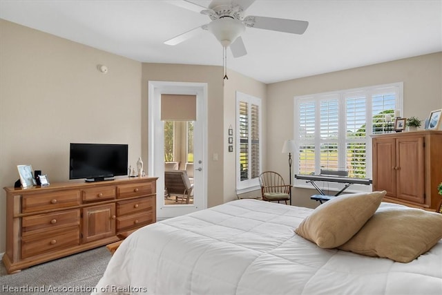 carpeted bedroom with access to outside and ceiling fan