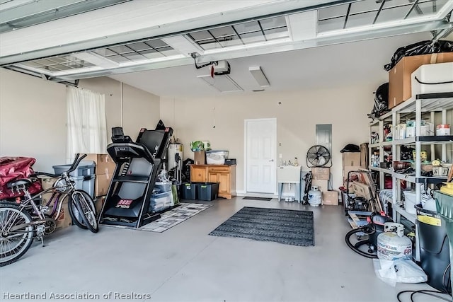 garage with sink and a garage door opener