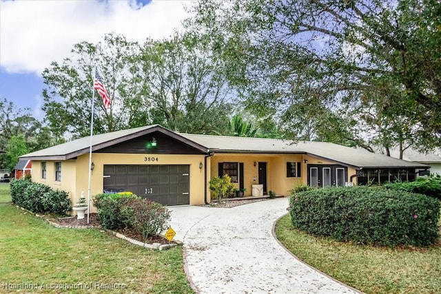 ranch-style home with a garage