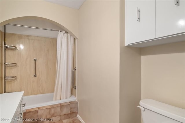 full bathroom with shower / bath combo, toilet, and vanity