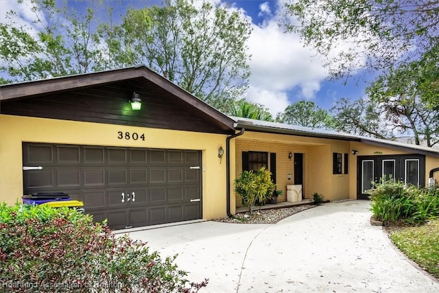 single story home with a garage