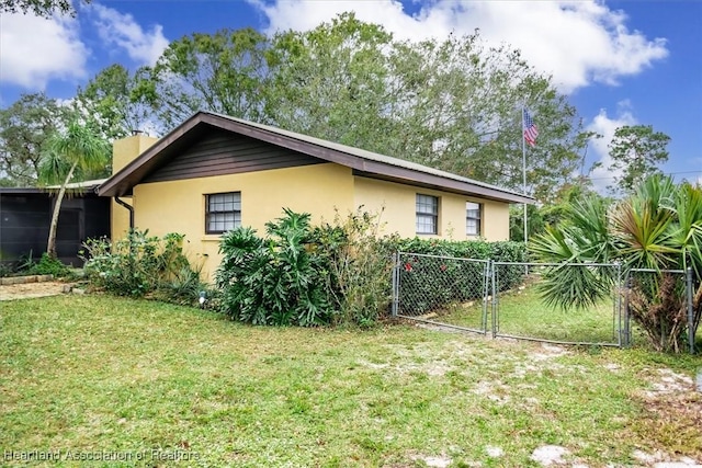 view of home's exterior featuring a yard