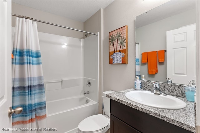 full bathroom with toilet, shower / bath combination with curtain, a textured ceiling, and vanity