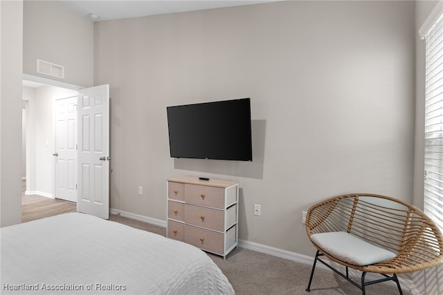 bedroom featuring carpet flooring, visible vents, and baseboards