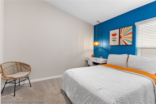 bedroom with baseboards and carpet flooring