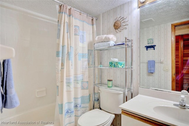 full bathroom with vanity, a textured ceiling, toilet, and shower / bath combo with shower curtain