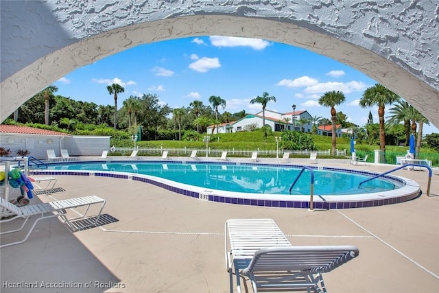 view of swimming pool with a patio area