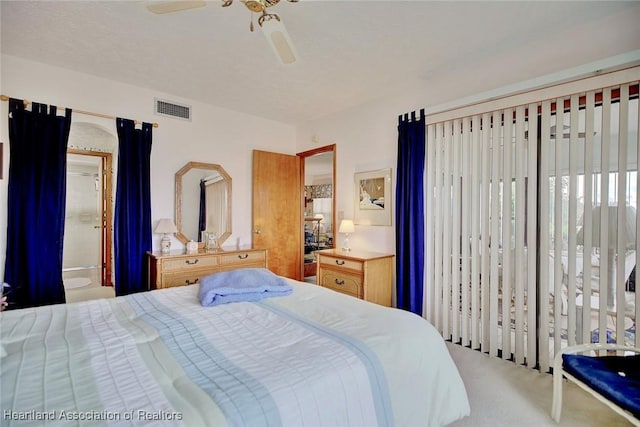 bedroom featuring carpet flooring, connected bathroom, and ceiling fan