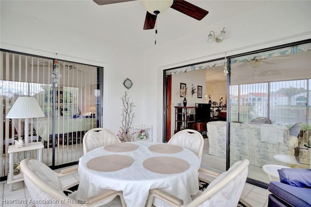 tiled dining room with ceiling fan