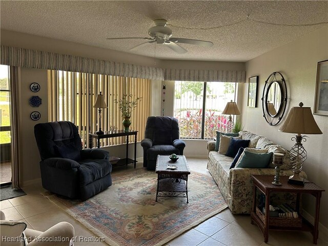 6000 Matanzas Dr, Sebring, FL 33872 - living room featuring tile patterned flooring, ceiling fan, and a textured ceiling