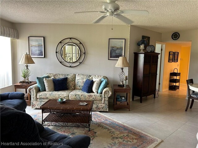 6000 Matanzas Dr, Sebring, FL 33872 - living room featuring ceiling fan, light tile patterned floors, and a textured ceiling