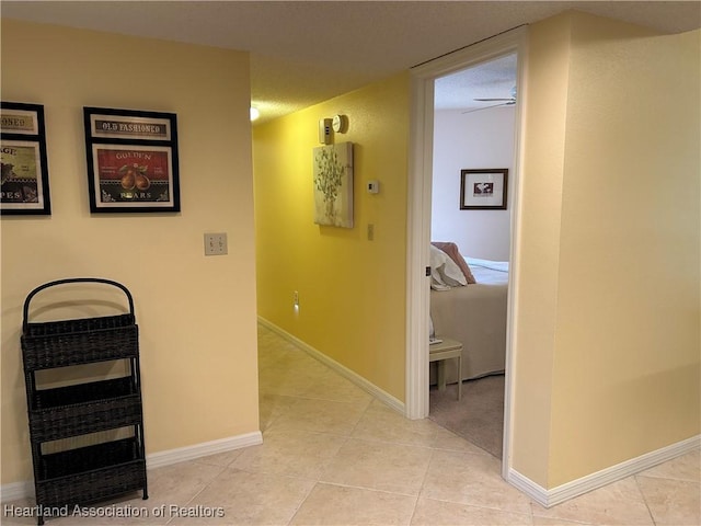 6000 Matanzas Dr, Sebring, FL 33872 - hallway featuring light tile patterned floors and baseboards