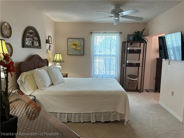 6000 Matanzas Dr, Sebring, FL 33872 - bedroom featuring light carpet, a textured ceiling, and ceiling fan