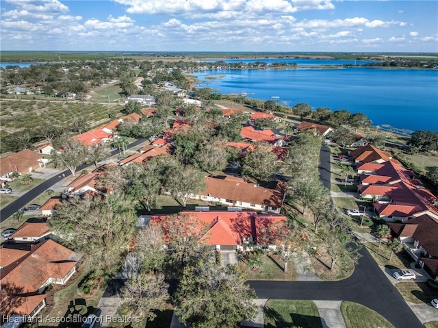 bird's eye view featuring a water view and a residential view