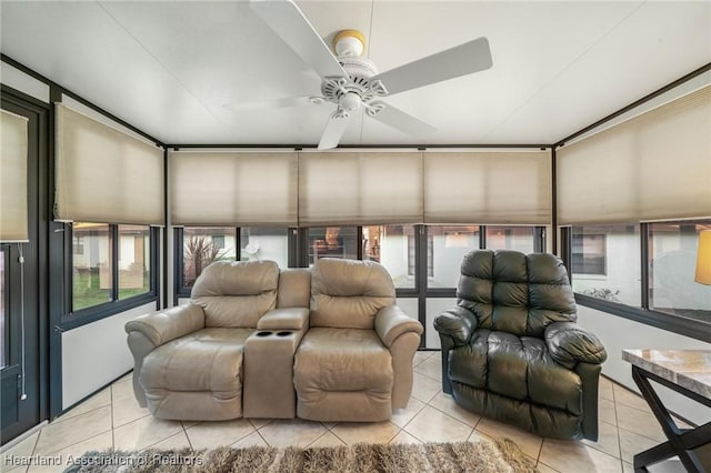 sunroom / solarium featuring ceiling fan