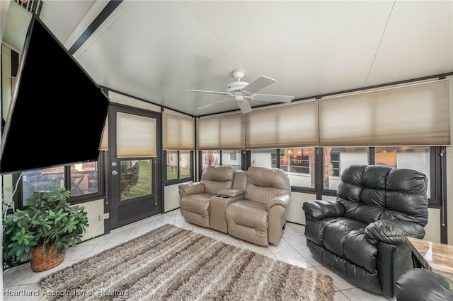 home theater featuring light tile patterned floors and a ceiling fan