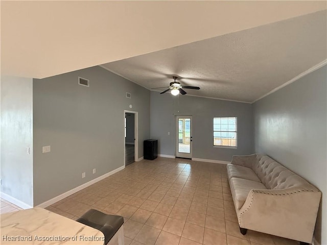 4329 Elson Ave, Sebring, FL 33875 - unfurnished living room featuring light tile patterned flooring, lofted ceiling, a textured ceiling, ceiling fan, and crown molding