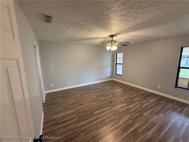 4329 Elson Ave, Sebring, FL 33875 - spare room featuring dark wood finished floors, ceiling fan, a textured ceiling, and baseboards