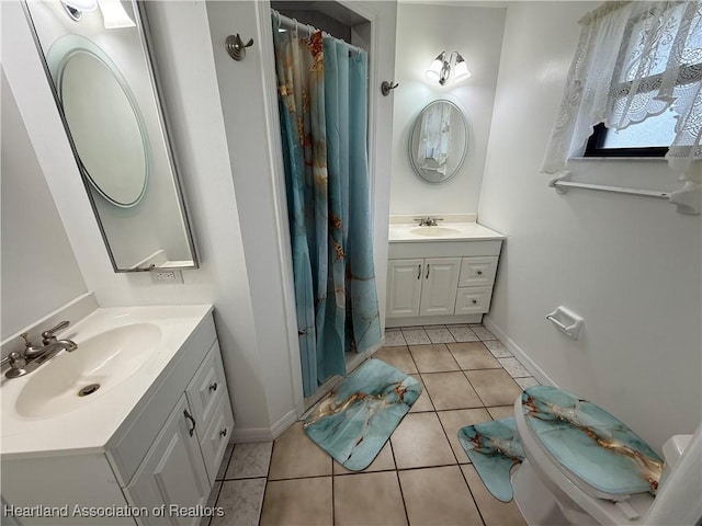 4329 Elson Ave, Sebring, FL 33875 - full bath featuring tile patterned flooring, two vanities, baseboards, and a shower with curtain