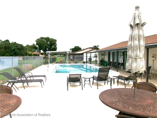 view of pool featuring a patio