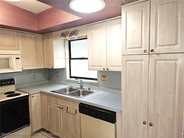 kitchen with white appliances and sink