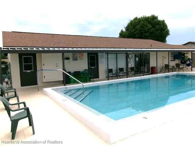 view of pool featuring a patio