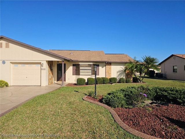 ranch-style home with a front yard and a garage