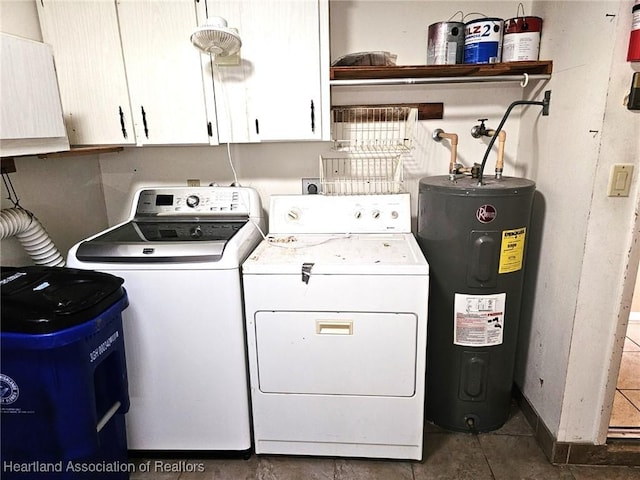 washroom featuring cabinets, electric water heater, and washing machine and dryer