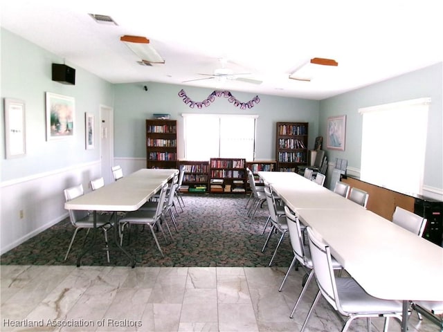 dining space with ceiling fan