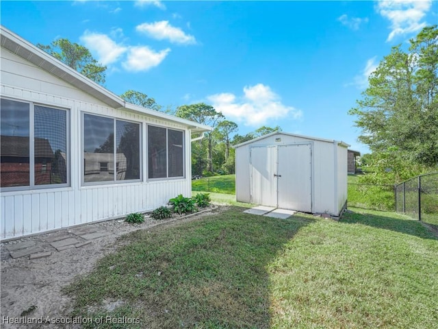 view of yard featuring a storage unit