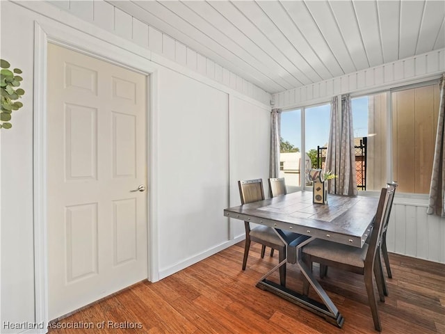 dining space with wood-type flooring