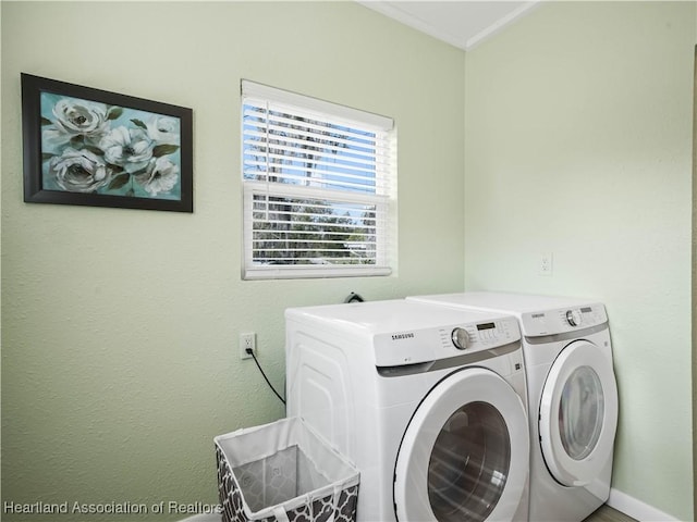 clothes washing area featuring washing machine and clothes dryer