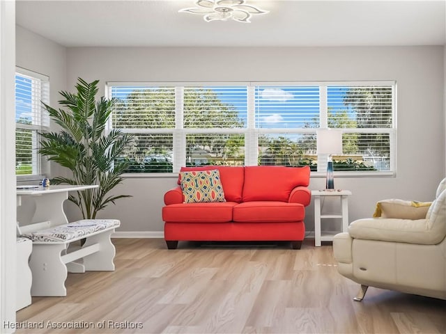 living area with hardwood / wood-style flooring