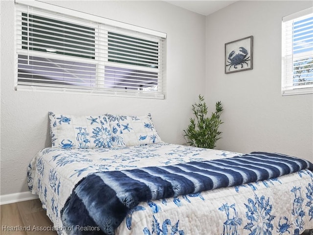 bedroom with hardwood / wood-style flooring