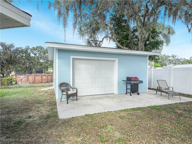 garage with a yard