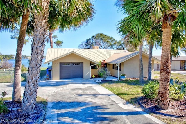 ranch-style house with a front lawn and a garage