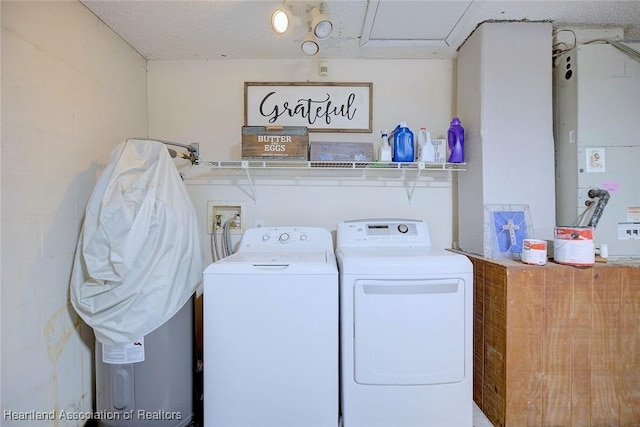 laundry area with washing machine and dryer