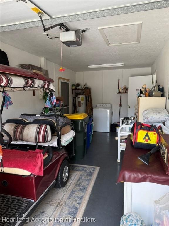 garage with a garage door opener, washer / clothes dryer, and water heater