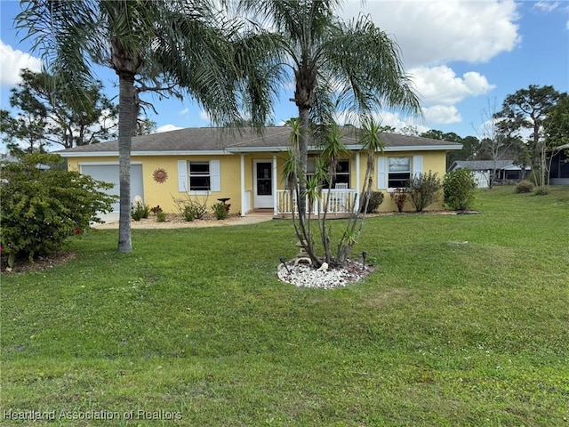 view of front facade with a garage and a front yard