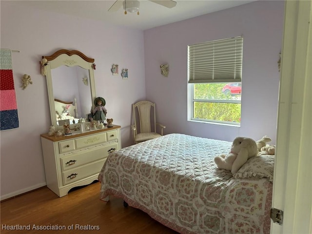 bedroom featuring ceiling fan and light hardwood / wood-style flooring