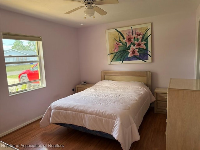 bedroom featuring dark wood-type flooring and ceiling fan