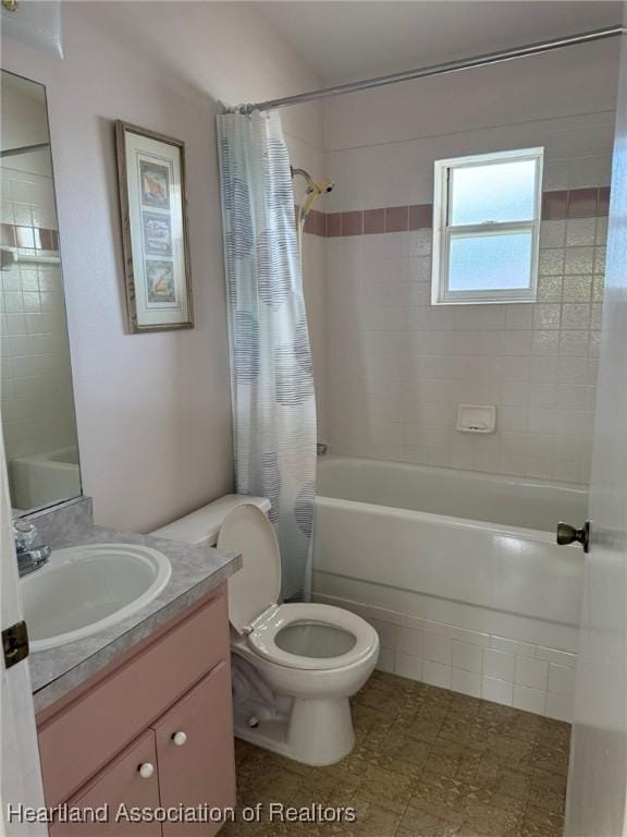 full bathroom featuring vanity, toilet, and shower / bath combo with shower curtain