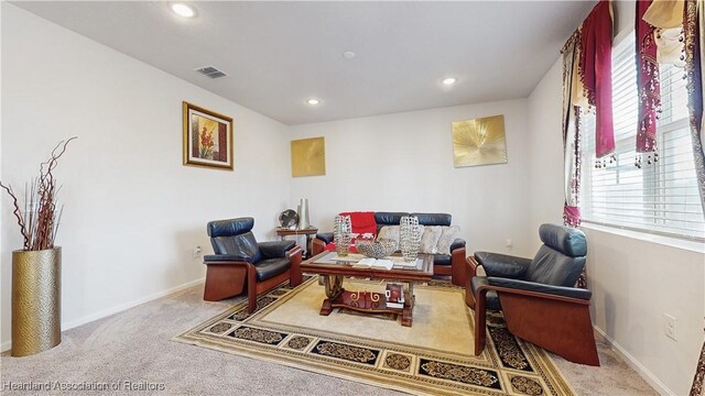 1076 Sugarwood St, Davenport, FL 33837 - sitting room with carpet floors, healthy amount of natural light, recessed lighting, and baseboards